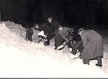 Volunteers clear the pitch January 1958